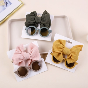 Three-piece baby bow nylon headband and round sunglasses set in green, pink, and yellow