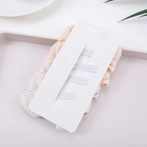 4-piece baby cotton bow hair clip set with floral scrunchies on white display card