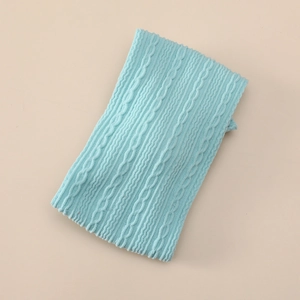Detailed macro view of light blue cable knit pattern on soft jacquard nylon baby headband