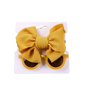 Bright yellow nylon bow headband and round sunglasses set for baby girls on card