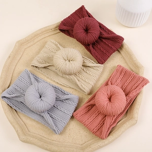 Bandeaux bébé en maille jacquard avec nœud en forme de donut en quatre coloris doux