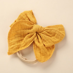 Details zur Baby-Haarband mit Baumwollschleife in Senfgelb und elastischem Nylonband
