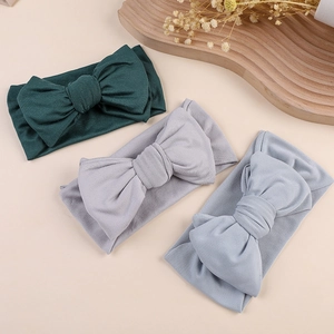 Three-piece set of baby bow headbands in dark green, light gray, and soft blue colors