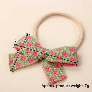 Newborn baby floral knit bow headband in soft mint green with pink heart patterns