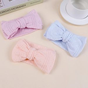 Three hollow knit baby bow headbands in pink, blue and orange-pink for kids