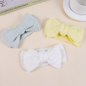 Baby knit headband set with large jacquard bows in light blue, yellow and white