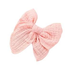 Handmade light pink cotton muslin bow hair clip for toddlers with soft texture