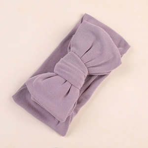 Detail view of smoky purple milk silk headband with a soft oversized handmade bow