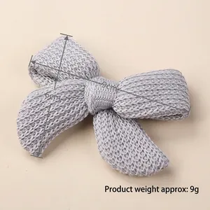Knitted grey hair bow for girls with 9x6cm dimensions and 9g lightweight design