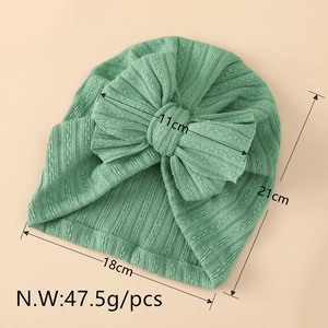 Detailed size chart of a ribbed light green baby turban hat with a large decorative bow