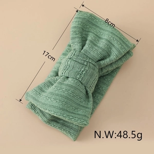 Green knitted rib headwrap with a large bow for baby girls, measuring 17cm by 8cm