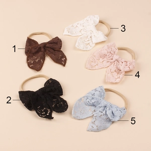 Detailed set of five vintage lace bow headbands for babies in assorted retro colors