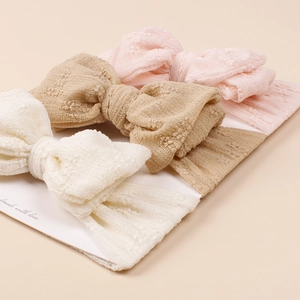 Ensemble de trois bandeaux élastiques pour bébé avec nœuds en dentelle tressée