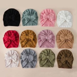 Detail of 12 colors soft ribbed knit baby turban hats with large decorative bow accents
