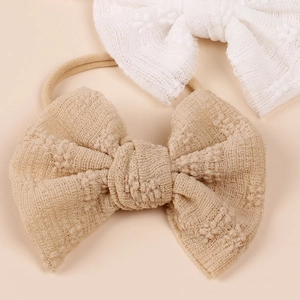 Newborn lace bow headband set with elastic nylon bands in beige and white colors