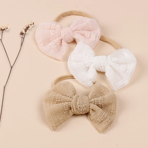 Baby nylon headbands with mesh lace bows in pink, white, and khaki colors