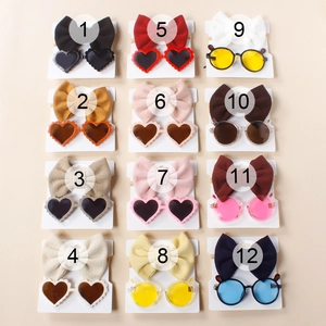 Detailed close-up of 12 color variations for baby bow headbands and matching sunglasses sets