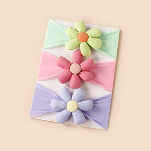 Three-piece baby flower headband set in mint green, pink, and lavender colors