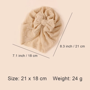 Beige soft stretch baby turban hat with double layer mesh bow and textured knit fabric