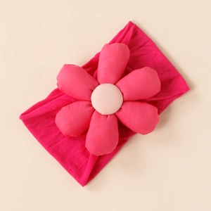 Close-up of bright pink elastic baby headband featuring a soft 3D padded flower detail