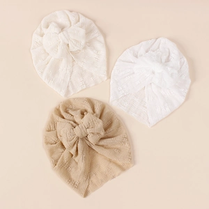 Three-pack of soft hollow-knit baby turban hats with large bows in neutral colors