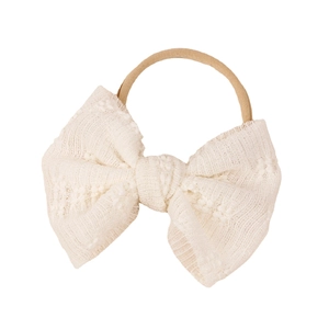 Newborn baby headband with cream mesh lace bow on elastic nude nylon hair band