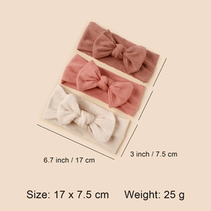 Set of 3 soft ribbed baby headbands with large bows in red-brown, dusty pink, and ivory