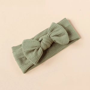 Detailed texture of the soft ribbed fabric on this morandi green baby bow headband