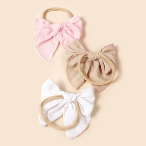 Ensemble de trois bandeaux à nœuds en lin pour bébés en rose clair, beige et blanc