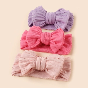 Lot de trois bandeaux de bébé en maille élastique avec grands nœuds rose et violet