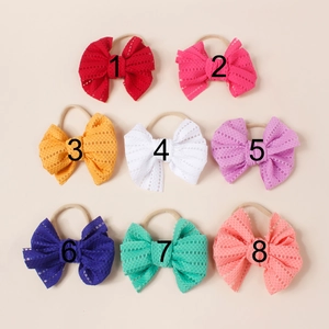 Detail view of 8 different colors mesh bow nylon headbands for babies and toddlers