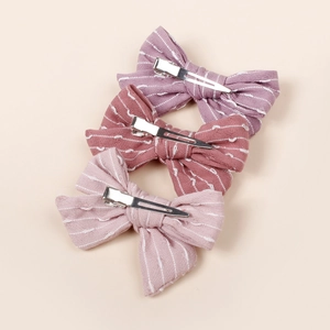 Trois barrettes à nœuds rayés en violet, rouge et rose pour coiffures de filles