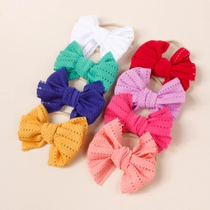 Set of 8 baby elastic mesh bow headbands in multiple colors for girls and infants