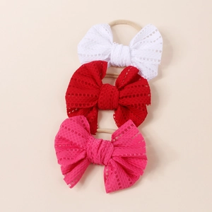 Three-pack baby headbands with large lace bows in white, red, and rose pink colors