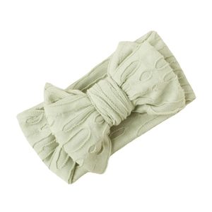 Bandeau bébé en tricot vert menthe élastique avec grand nœud creux et texture douce