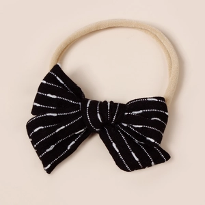 Detail of soft nylon baby headband featuring a black striped bow with high-elastic band