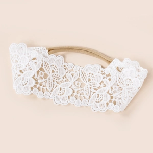 Bandeau bébé en dentelle blanche brodée avec bande en nylon souple et très élastique