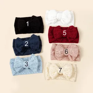 Detail of seven lace baby headbands with bowknots in various elegant colors