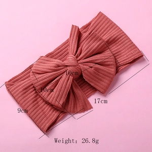 Pink ribbed knit baby headband size chart showing bow dimensions and 17cm total length