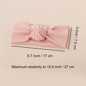 Pink ribbed knit baby headband with elastic knot design for comfortable infant wear