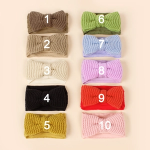 Collection of ten knitted baby headbands with bow details in various vibrant colors