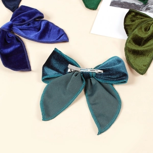 Velvet swallowtail bow hair clips in navy and forest green with silver metal alligator clips