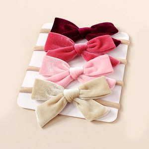 Lot de quatre bandeaux en velours pour bébé avec nœuds faits main sur élastique