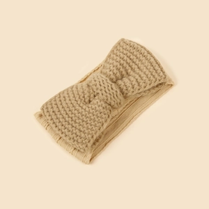 Beige knitted bow headband for baby with soft jacquard texture and warm ear protection
