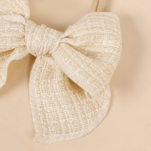 Bandeau élastique pour bébé fille avec nœud en tweed crème doux et confortable