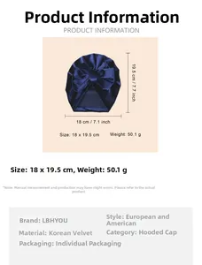 Detail view of navy velvet baby turban hat with oversized bow and product dimensions