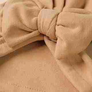 Camel cashmere bow baby turban hat showing soft knitted texture for newborns