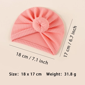 Pink ribbed baby turban hat with donut knot, showing size details 18 x 17 cm and weight