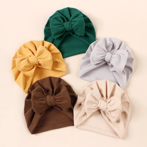 Five-pack of soft baby turban hats with large bows in varied neutral earthy tones