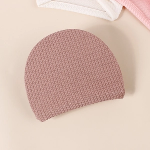 Pink waffle knit baby donut hat with bow, soft ribbed turban cap for newborn infants